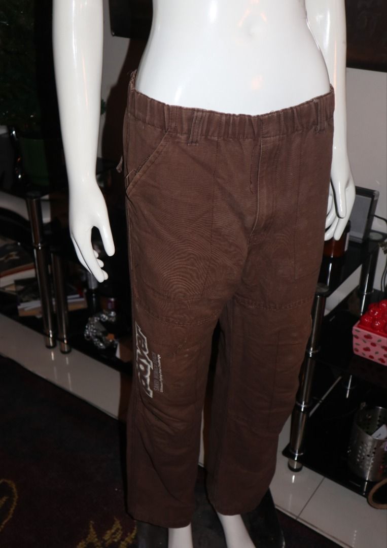 Player Brown Cargo Pants (Category: Joggers) located in Paranaque City. Submitted by skulkch (Listing ID 1469362707, Image 2). Description: - Color: Brown - Material: Durable canvas - Fit: Relaxed fit with an easy-to-wear elastic waistband - Design: 'PLAYER' graphic text print on the right leg - Features: Multiple utility pockets and reinforced knee panels - Style: Comfortable daily streetwear.