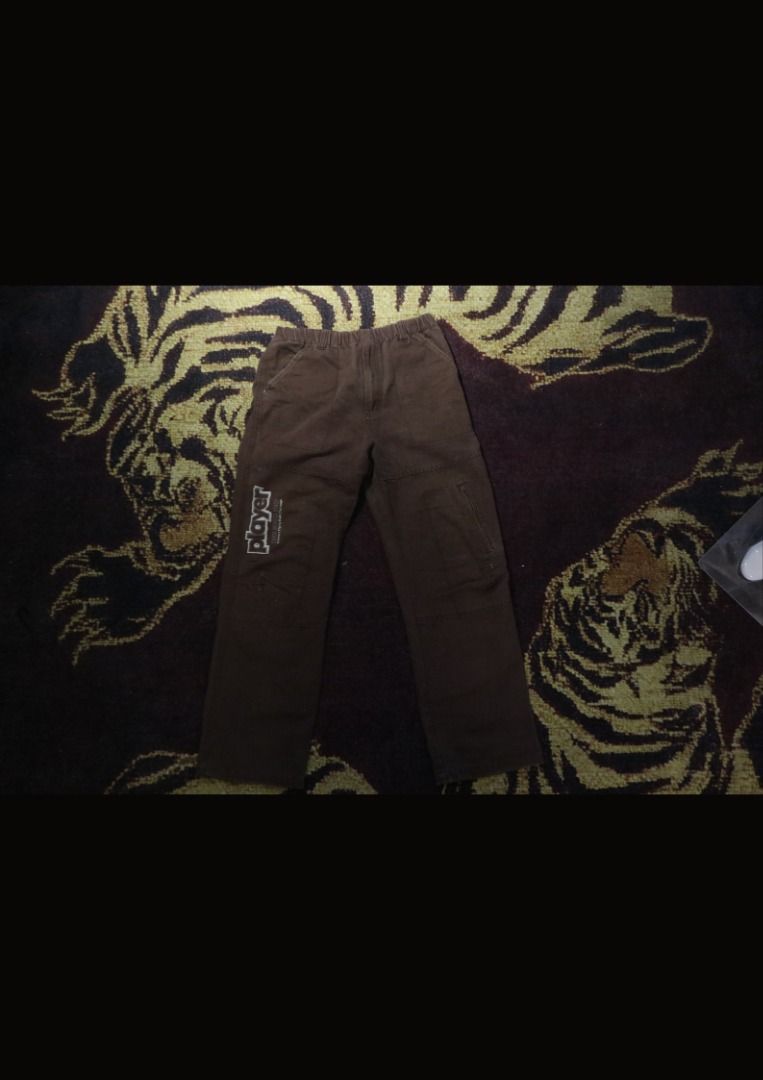 Player Brown Cargo Pants (Category: Joggers) located in Paranaque City. Submitted by skulkch (Listing ID 1469362707, Image 3). Description: - Color: Brown - Material: Durable canvas - Fit: Relaxed fit with an easy-to-wear elastic waistband - Design: 'PLAYER' graphic text print on the right leg - Features: Multiple utility pockets and reinforced knee panels - Style: Comfortable daily streetwear.