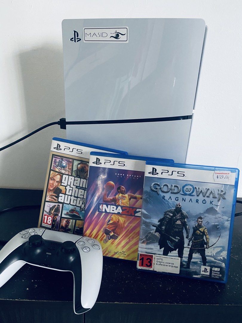 PlayStation 5 Console with Controller and Three Games (Category: PlayStation) located in Caloocan City. Submitted by rjane1204 (Listing ID 1469168309, Image 1). Description: - PlayStation 5 console (Standard White) in clean, working condition -No Box - 1 DualSense wireless controller included - 3 physical game discs: Grand Theft Auto, NBA 2K24 Kobe Bryant Edition, and God of War Ragnarök - Ready for immediate pickup or shipping - Message for inqu
