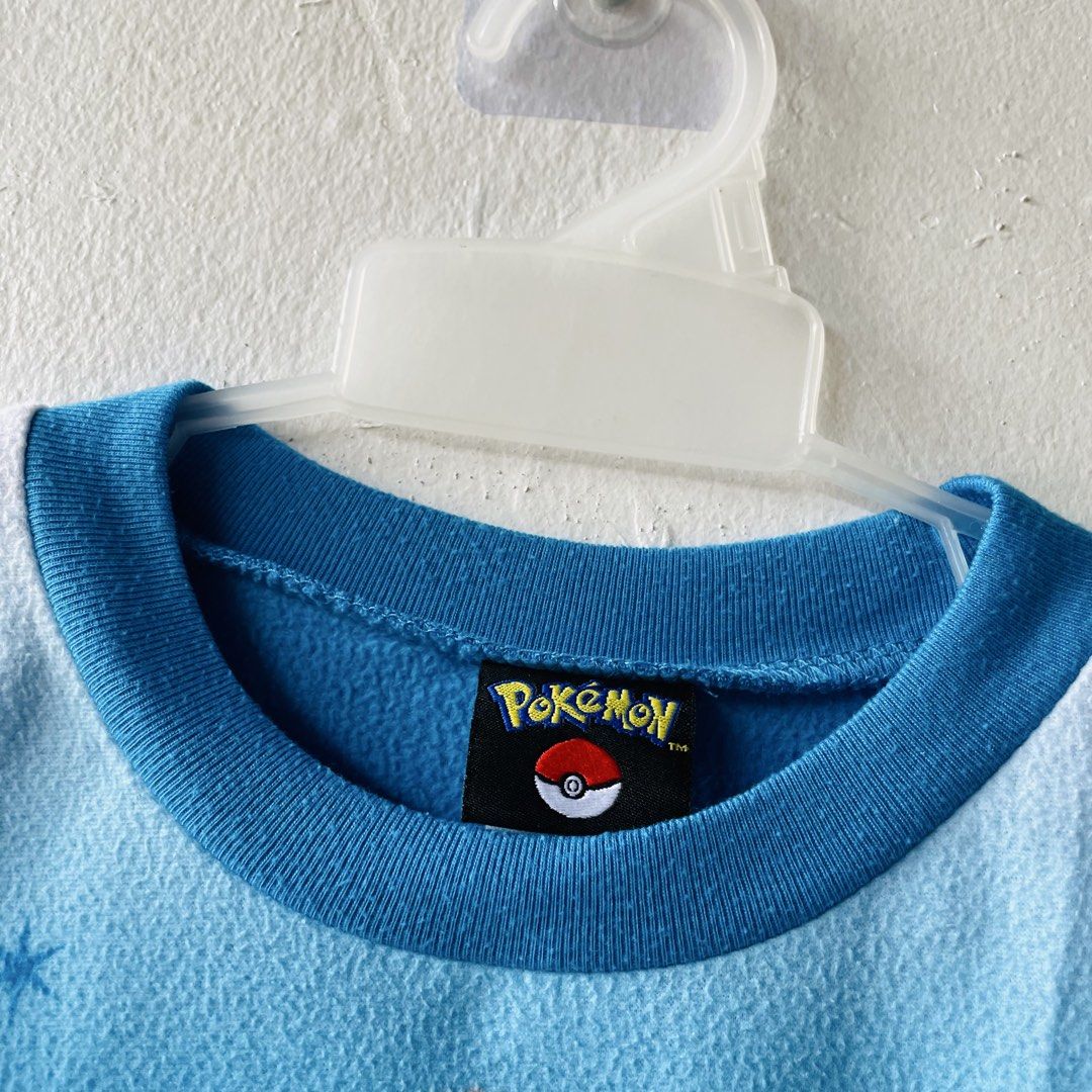 Pokemon Pikachu Christmas Sweater (Category: Babies & Kids Fashion) located in Caloocan City. Submitted by lovemyclothes21 (Listing ID 1469267764, Image 2). Description: - Size: 7 to 8 years old - Material: Soft, fuzzy light blue fleece - Design: Pikachu in a Santa hat with a Christmas tree - Features: Long sleeves and comfy ribbed collar trim - Condition: Great winter sweater for young Pokemon fans.