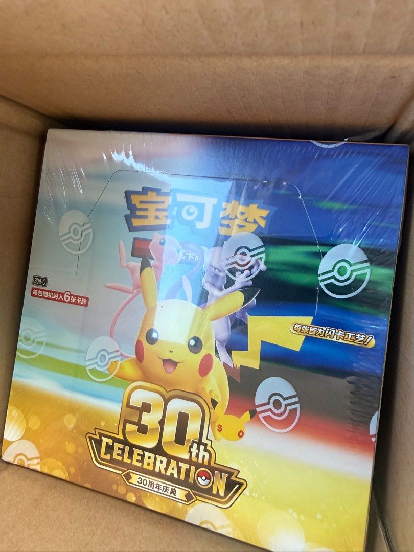Pokémon 30th Celebration Booster Box Mandarin (Category: Card Boxes & Cases) located in Manila. Submitted by ra_pimentel (Listing ID 1469316652, Image 1). Description: Sealed 30th Celebration Pokémon booster box featuring iconic characters like Pikachu, Mew, and Mewtwo on the packaging. This box contains packs with 6 cards each, and every card is guaranteed to have a special foil finish. Perfect for collectors looking to add a unique anniversary-