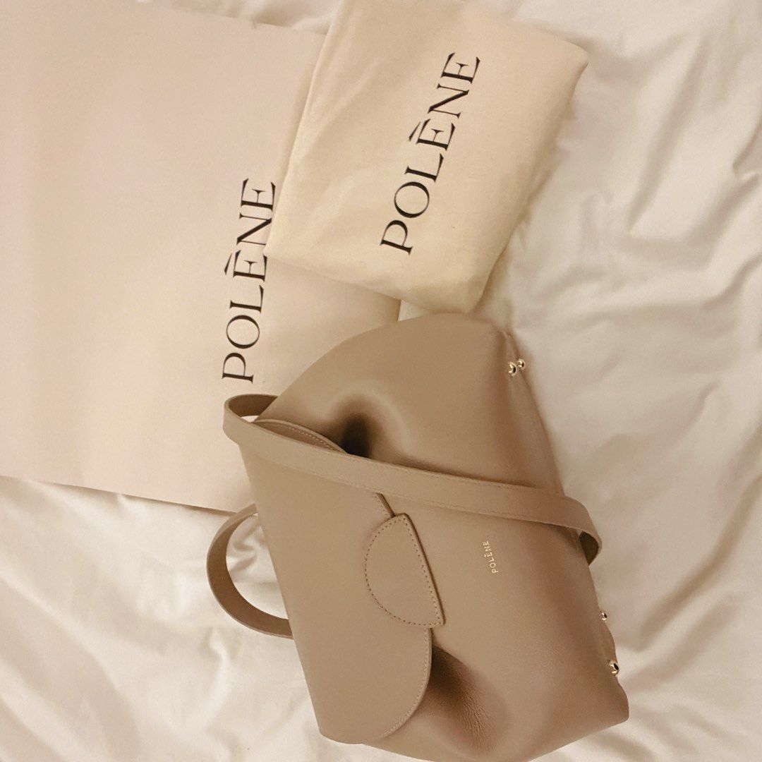 polene numero un (Category: Shoulder Bags) located in Quezon City. Submitted by gutchiboi (Listing ID 1469283921, Image 3). Description: Authentic Polène Numéro Un – Textured Taupe Purchased personally by my wife in Paris in 2025. One of Polène’s signature designs, crafted from textured Italian calf leather, featuring sculpted folds, a rounded flap, classic top handle, and detachable shoulder strap. Condition: Mint / Pristine. The front button cl