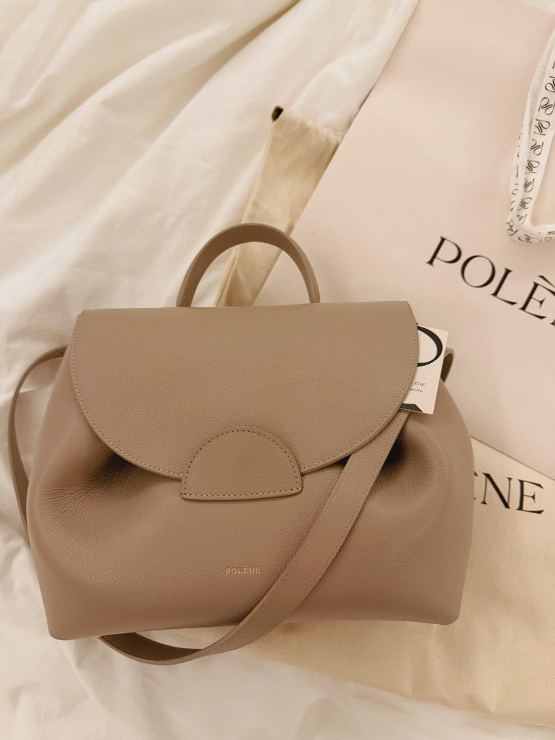 polene numero un (Category: Shoulder Bags) located in Quezon City. Submitted by gutchiboi (Listing ID 1469283921, Image 1). Description: Authentic Polène Numéro Un – Textured Taupe Purchased personally by my wife in Paris in 2025. One of Polène’s signature designs, crafted from textured Italian calf leather, featuring sculpted folds, a rounded flap, classic top handle, and detachable shoulder strap. Condition: Mint / Pristine. The front button cl
