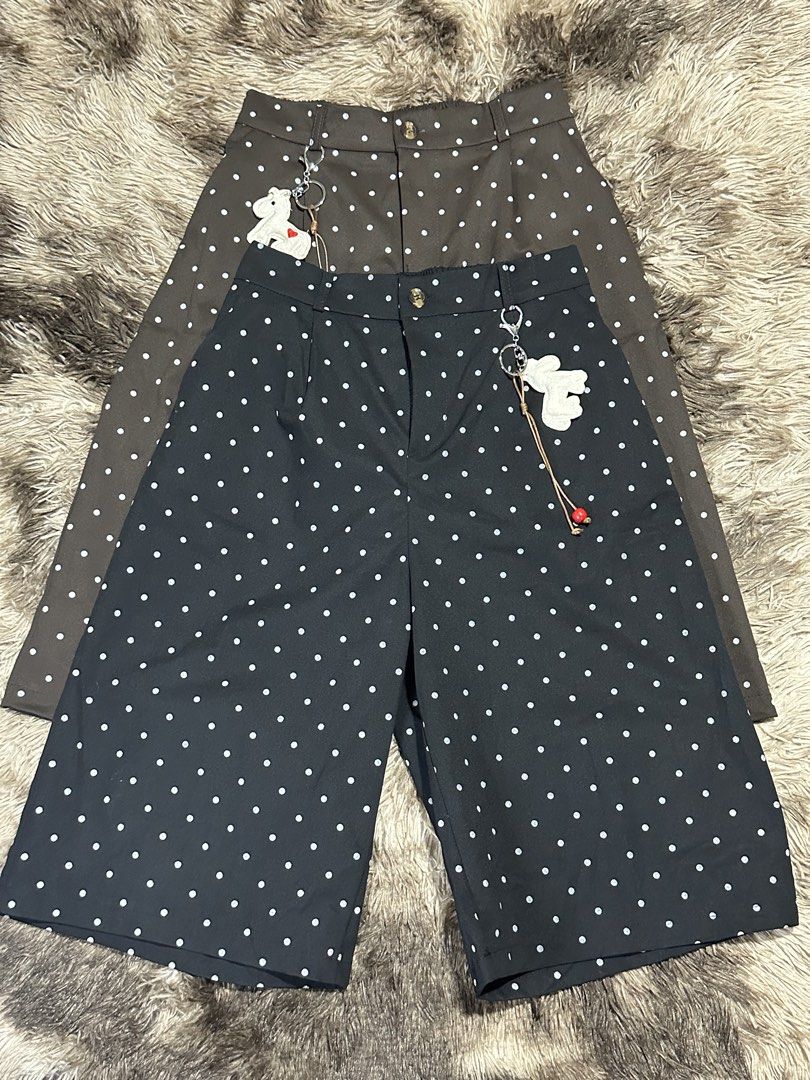 Polka Jorts with keychain (Category: Shorts) located in Manila. Submitted by bizfits_ (Listing ID 1469358380, Image 1). Description: - Available Colors: Black and Brown - Fit & Closure: High-waisted with secure button and zipper - Bonus: Includes a cute dangling white animal keychain on the belt loop - Material: Comfy, breathable fabric - Styling: Easy to match with crop tops or tees for casual outings.