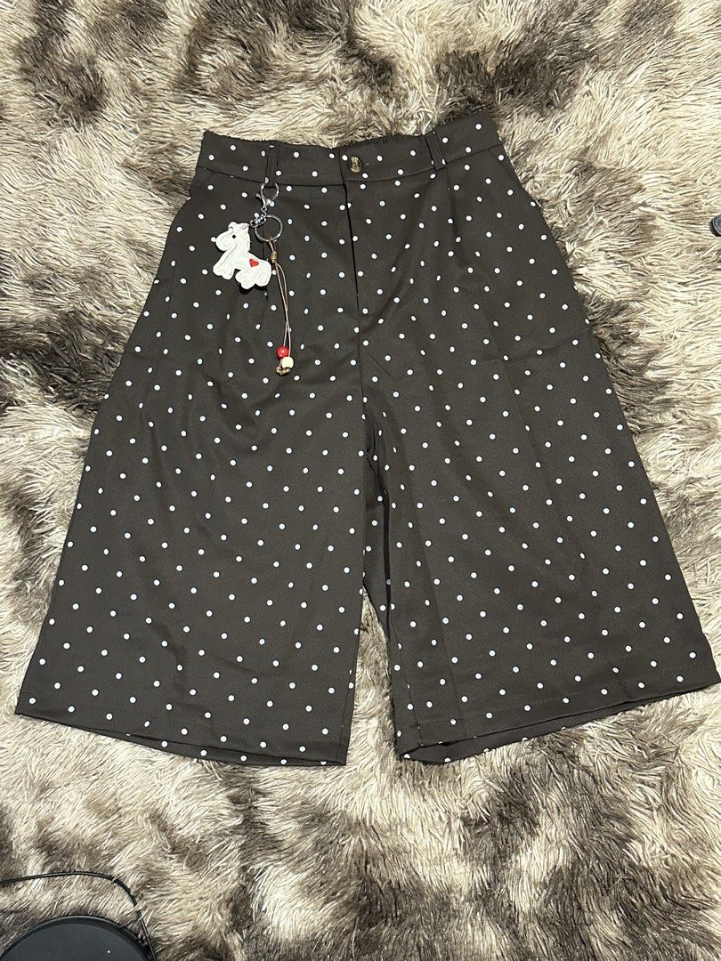 Polka Jorts with keychain (Category: Shorts) located in Manila. Submitted by bizfits_ (Listing ID 1469358380, Image 2). Description: - Available Colors: Black and Brown - Fit & Closure: High-waisted with secure button and zipper - Bonus: Includes a cute dangling white animal keychain on the belt loop - Material: Comfy, breathable fabric - Styling: Easy to match with crop tops or tees for casual outings.