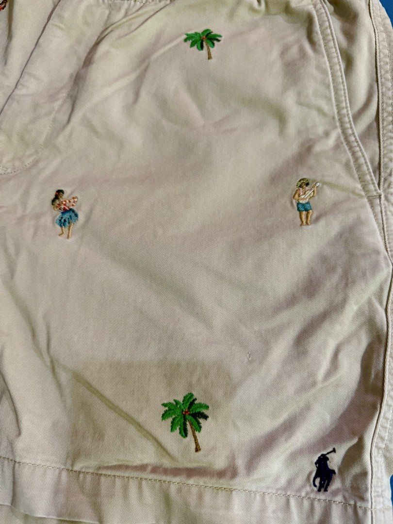 Polo Ralph Lauren Hula Dancer Palm Tree Shorts (Category: Shorts) located in Manila. Submitted by rojotesoro (Listing ID 1469229873, Image 2). Description: - Brand: Polo Ralph Lauren - Style: Stretch classic fit shorts with elastic waistband and zipper fly - Color: Tan khaki - Design: Unique all-over hula dancer and palm tree embroidered pattern, with signature pony logo near hem - Material: Comfortable cotton and elastane blend - Ideal for: Summ