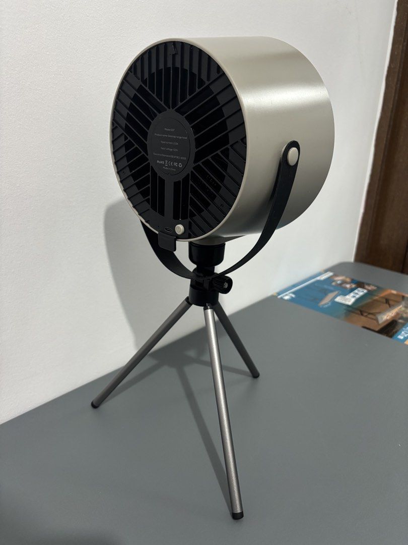 Portable Range Hood with Tripod (Category: Hobs & Hoods) located in Manila. Submitted by safefire.ae92b7 (Listing ID 1469358445, Image 3). Description: Portable Range Hood - Color: Grey cylindrical body with black front grille and filter pad - Design: Mounted on an adjustable metal tripod stand with a convenient side strap handle - Power: USB Type-C port on the back - Perfect for: Perfect for condos without a range hood, gets rid of smoke fast an