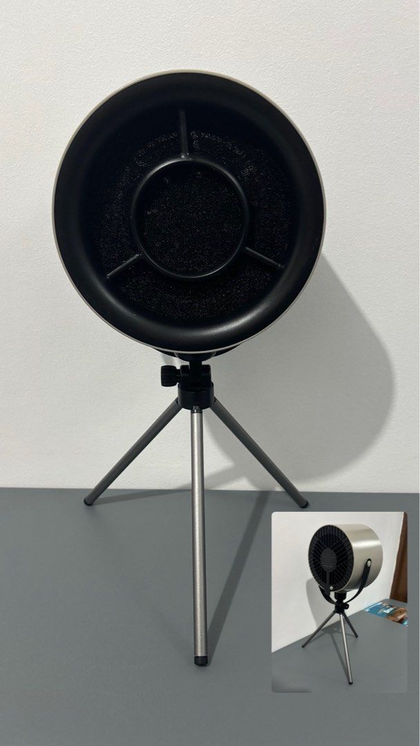 Portable Range Hood with Tripod (Category: Hobs & Hoods) located in Manila. Submitted by safefire.ae92b7 (Listing ID 1469358445, Image 1). Description: Portable Range Hood - Color: Grey cylindrical body with black front grille and filter pad - Design: Mounted on an adjustable metal tripod stand with a convenient side strap handle - Power: USB Type-C port on the back - Perfect for: Perfect for condos without a range hood, gets rid of smoke fast an