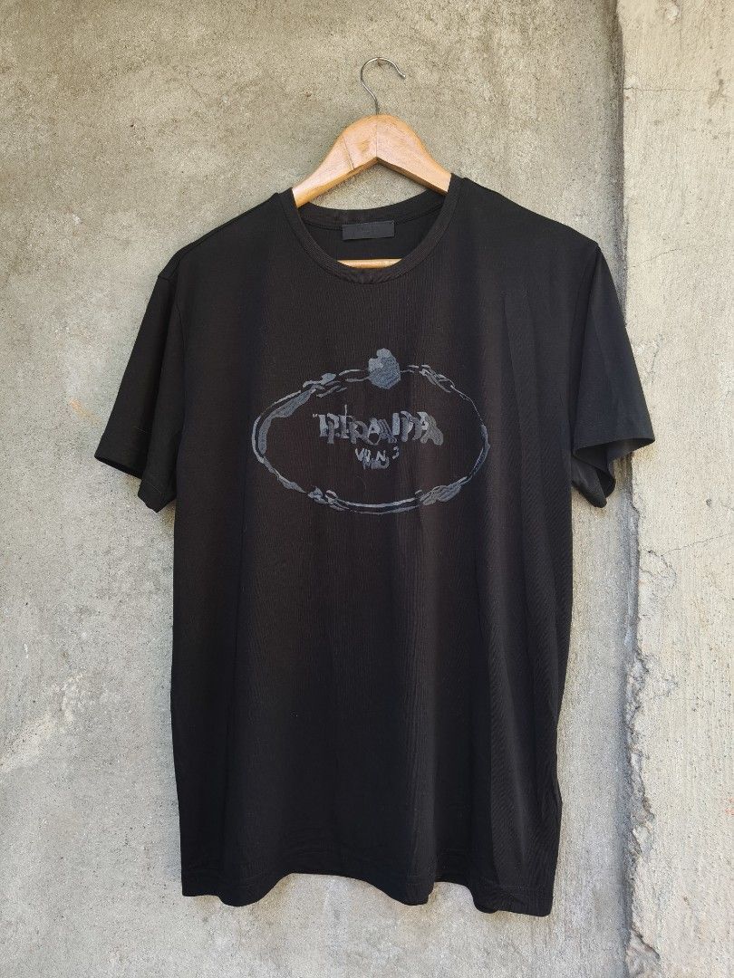 Prada Girocollo Ricamo Shirt (Category: Tshirts & Polo Shirts ) located in Puerto Princesa. Submitted by dripthrift99 (Listing ID 1469164074, Image 1). Description: Prada Girocollo Ricamo Shirt Medium 21" width 26.5" length Excellent condition no any issue loc: palawan.