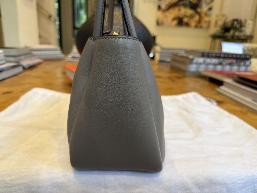 Prada Gray Leather Shoulder Bag (Category: Luxury Bags & Wallets) located in Manila. Submitted by moscloset (Listing ID 1469227633, Image 3). Description: AUTHENTIC PRADA MEDIUM DARLING BAG Perfect for everyday use Current Market Price: ₱200,000 Condition: Good (8/10) Reason for Selling: Making room for a new bag Additional Details - Color: Clay with metal hardware Worn: A few times (purchased 2024) Flaws: With slightly visible scuffing above the