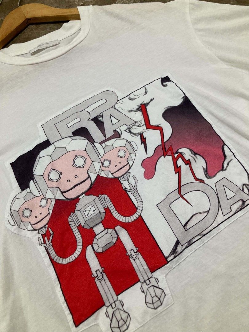 Prada Monkey Robot Graphic Tee (Authentic) (Category: Tshirts & Polo Shirts ) located in San Jose del Monte. Submitted by zen31 (Listing ID 1469359202, Image 2). Description: PRADA TEE (AUTHENTIC) 21.5X27 DIMENSION EXCELLENT CONDITION 10/10 COLOR RATE NO ISSUE.