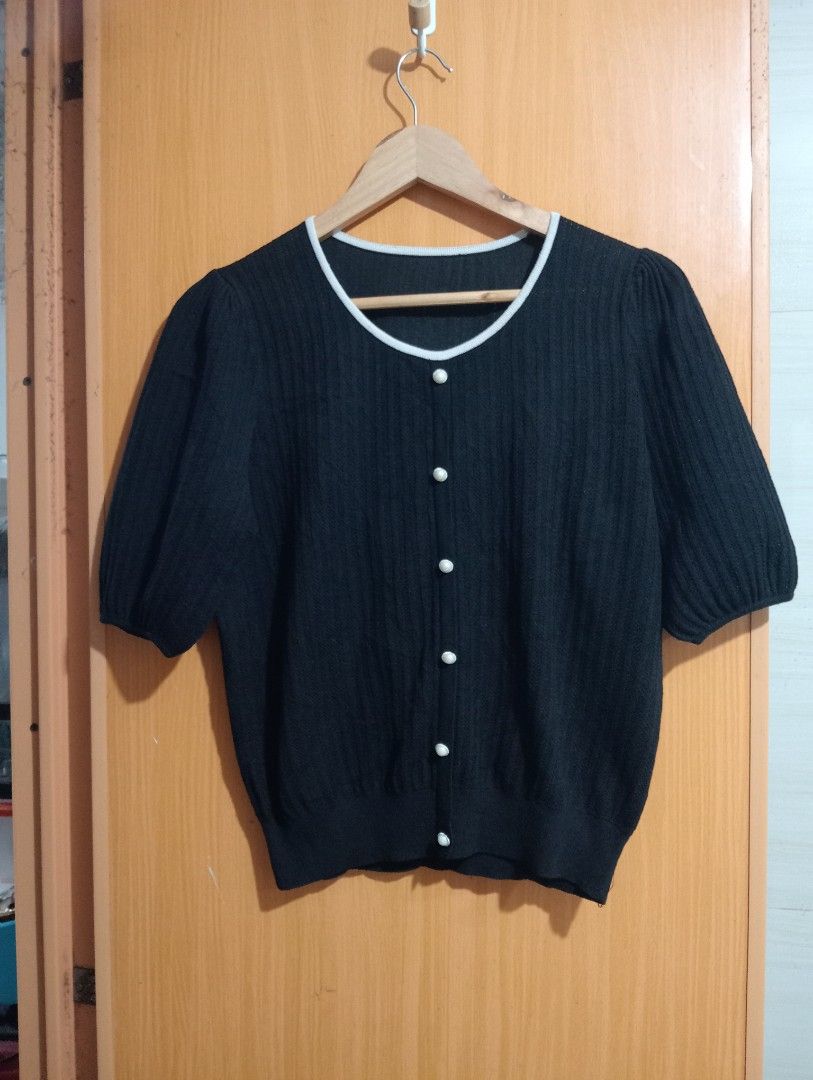 Preloved Black Button Eyelet Knitted Top (Category: Blouses) located in Manila. Submitted by cenasells (Listing ID 1469339119, Image 1). Description: Preloved Knitted Crochet Eyelet Width: 19.5 inches Length : 21 inches Fabric : Knitted Crochet.