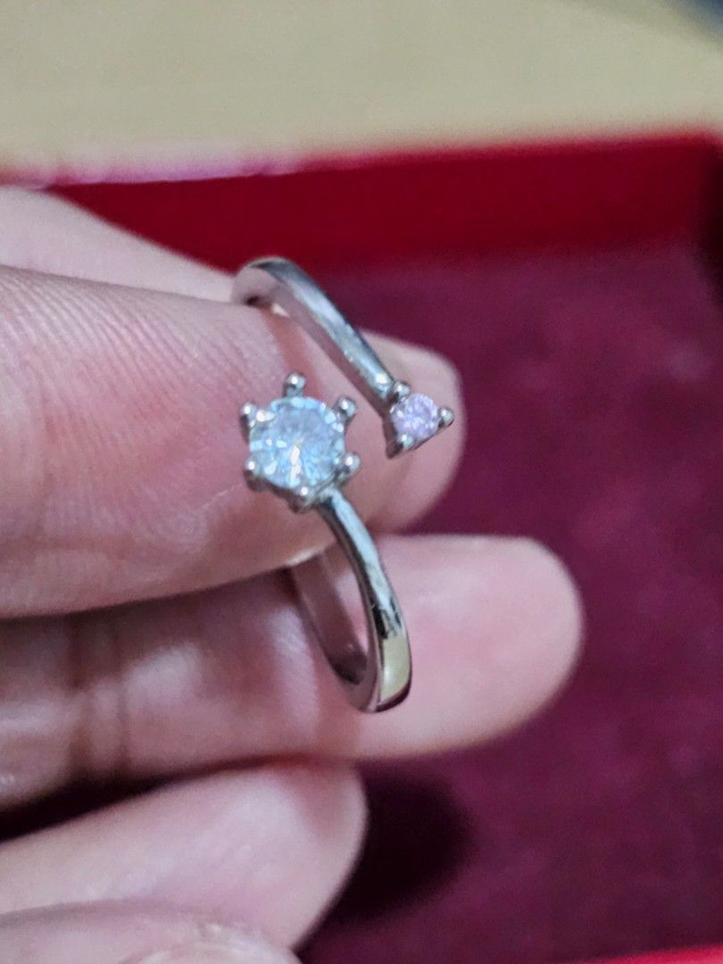 Pre-loved S925 Silver Open Ring with Clear and Pink Crystals (Category: Rings) located in Caloocan City. Submitted by smart_shoppers_ville (Listing ID 1469169692, Image 2). Description: - Material: Genuine S925 Sterling Silver (hallmarked) - Design: Adjustable minimalist wrap style with open ends - Stones: Features a larger clear crystal and a smaller pink crystal - Comfort: Easy to adjust and comfortable for daily wear.