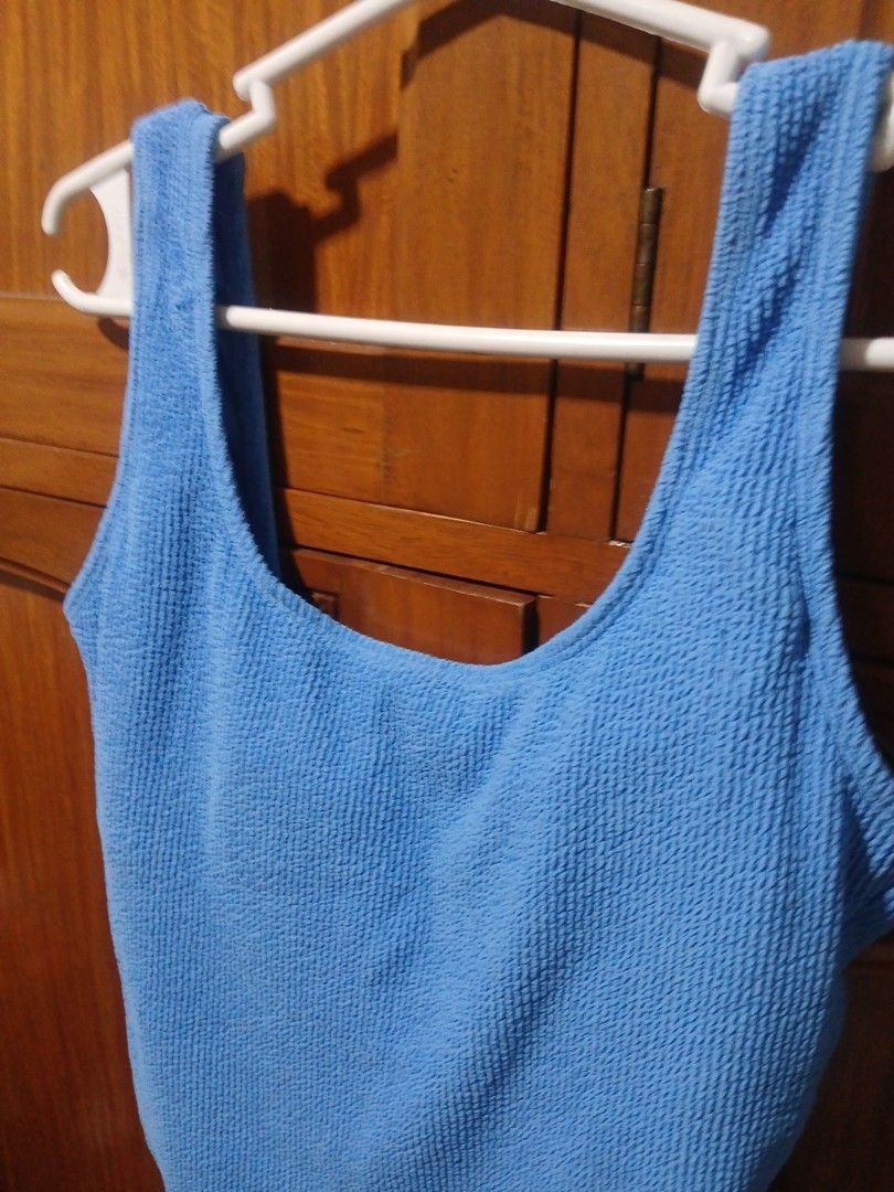 Primark Blue Crinkle One-Piece Swimsuit Size S (Category: Bikinis & Swimsuits) located in Malolos. Submitted by mockingjay.0308 (Listing ID 1469204791, Image 2). Description: - Brand: Primark Cares - Color: Bright blue - Material: Textured crinkle fabric with clean inner lining - Style: Scoop neckline and matching scoop back one-piece - Size: Tagged Size S (fits UK 10-12, EUR 38-40, US 6-8) - Condition: Great for beach trips and pool days.