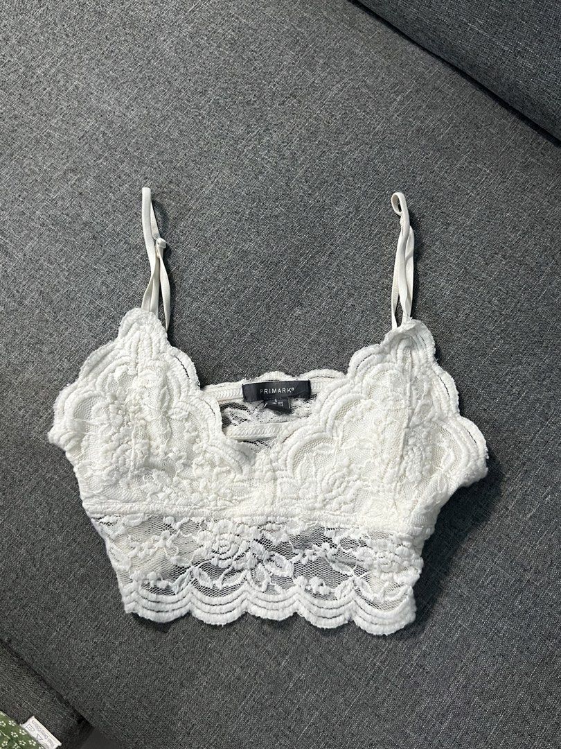 Primark White Lace Bralette Crop Top (Category: Sleeveless) located in Angeles City. Submitted by camieday24 (Listing ID 1469355680, Image 1). Description: - Brand: Primark - Size: S (Stretchy and super comfy fabric) - Design: White lace with a pretty scallop hem and delicate strap details - Condition: Worn once for a quick mirror selfie, freshly washed and clean - Styling Tip: Looks amazing paired with high-waisted pants!.