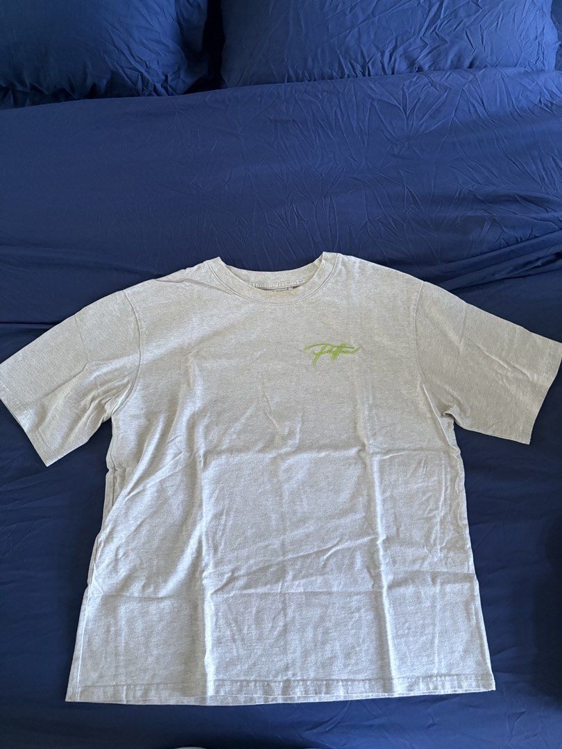 Patton Primitive Grey T-shirt with Green Logo (Category: Tshirts & Polo Shirts ) located in Bacoor. Submitted by poutychae (Listing ID 1469202303, Image 1). Description: - Brand: Patton - Color: Grey with small neon green script logo on chest - Fit: Relaxed fit with crew neck collar - Material: Comfortable cotton blend - Condition: Brand new / Excellent - Great for everyday casual wear.