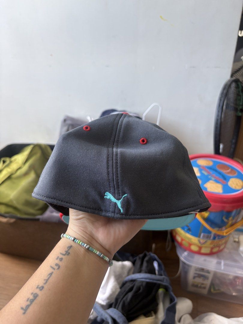 Puma Flat Brim Cap Grey Red (Category: Caps & Hats) located in Manila. Submitted by roccolini (Listing ID 1469218845, Image 2). Description: - Brand: Puma - Style: Flat brim cap with structured crown - Colorway: Grey body with bright red flat brim - Details: Mint green leaping cat logo embroidered on front and back, red embroidered eyelets - Condition: Brand new, original sticker still on the brim - Perfect for daily wear or streetwear styling.