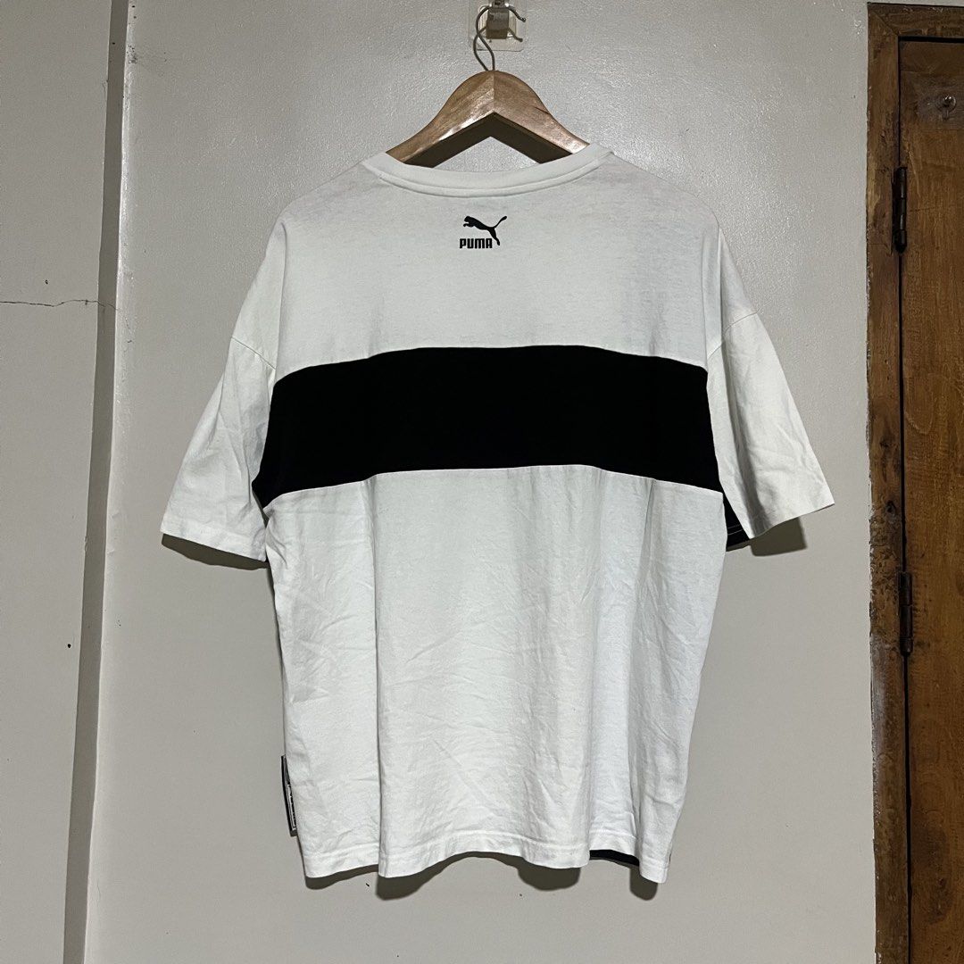 Puma White Black Colorblock Tee Shirt (Category: Formal Shirts) located in Argao. Submitted by secondcyclecollection (Listing ID 1469293908, Image 1). Description: - Brand: Puma - Color: White with striking black colorblock panel and back band - Details: Embroidered script Puma logo, Puma Team label near lower hem, branded inner neck taping - Size: Asia S on Tag Fit Largw To XL - Condition: Brand new / Excellent - Mode of Payment: GCash, BPI, or 