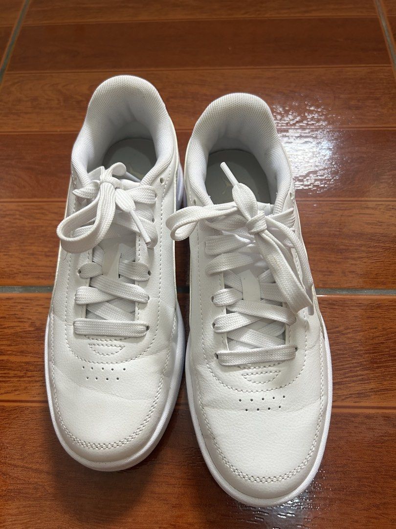 Puma White Sneakers Size US 5 (Category: Sneakers) located in Manila. Submitted by la_apparel (Listing ID 1469168935, Image 2). Description: - Brand: Puma - Style: Low-top sneakers - Color: Classic White - Size: UK 4 / EUR 37 / US 5 / CM 23 - Material: Clean leather upper with breathable perforated toe box - Condition: Minimal wear with clean soles - Features: Signature Formstrip detail, lace-up closure, padded collar and tongue for extra comfort