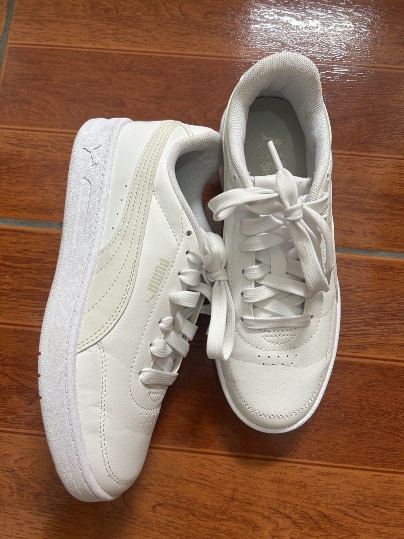 Puma White Sneakers Size US 5 (Category: Sneakers) located in Manila. Submitted by la_apparel (Listing ID 1469168935, Image 1). Description: - Brand: Puma - Style: Low-top sneakers - Color: Classic White - Size: UK 4 / EUR 37 / US 5 / CM 23 - Material: Clean leather upper with breathable perforated toe box - Condition: Minimal wear with clean soles - Features: Signature Formstrip detail, lace-up closure, padded collar and tongue for extra comfort