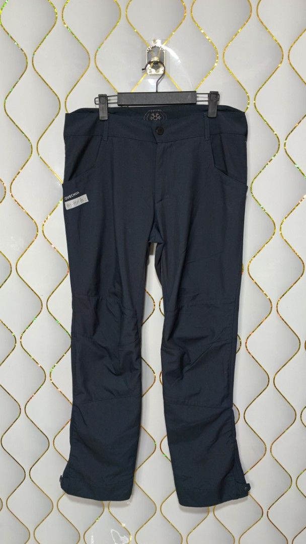Quechua Hiking Pants Dark Grey (Category: Activewear) located in Manila. Submitted by zariyah.1986 (Listing ID 1469175077, Image 1). Description: - Brand: Quechua - Color: Dark grey - Size: 33-34 - Features: Button closure, belt loops, and adjustable snap buttons at the ankle cuffs - Material: Sturdy, durable fabric built for the outdoors - Best for: Hiking, camping, trails, and outdoor activities.