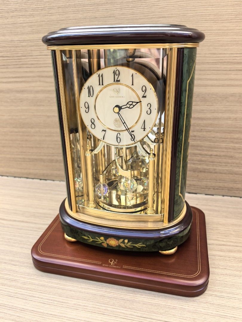 QUEEN ELIZABETH II QE2 RHYTHM TABLE CLOCK (Category: Clocks) located in Quezon City. Submitted by vintagespektroom (Listing ID 1469312553, Image 1). Description: 🕰️ FOR SALE: QUEEN ELIZABETH II QE2 RHYTHM TABLE CLOCK 🇮🇹 ✨ Elegant • Classic • Collectible ✨ For sale Queen Elizabeth II QE2 Rhythm Table Clock, made in Italy. Featuring a luxurious green inlaid finish, this sophisticated timepiece is perfect for collectors, clock enthusiasts. 💎 Det
