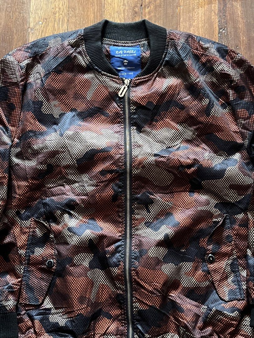 Ray Hagel Camouflage Bomber Jacket (Category: Coats, Jackets and Outerwear) located in Los Banos. Submitted by lootmeup (Listing ID 1469198663, Image 2). Description: Ray Hagel Camouflage Bomber Jacket Size: Width: 25 Length: 28 Mine P600.