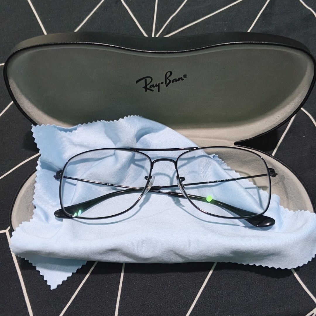 Ray-Ban RB 6498 Aviator Eyeglasses Black Frame (Category: Sunglasses & Eyewear) located in Manila. Submitted by xvx02 (Listing ID 1469266088, Image 1). Description: - Authentic Ray-Ban RB 6498 optical frames (Model: RB 6498 2509 55-15) - Classic double bridge pilot shape in sleek black - Size: Lens 55, Bridge 15, Temple 140 - Flawless condition: Zero scratches on frame and lenses - Includes original Ray-Ban hard leather case and light blue microf