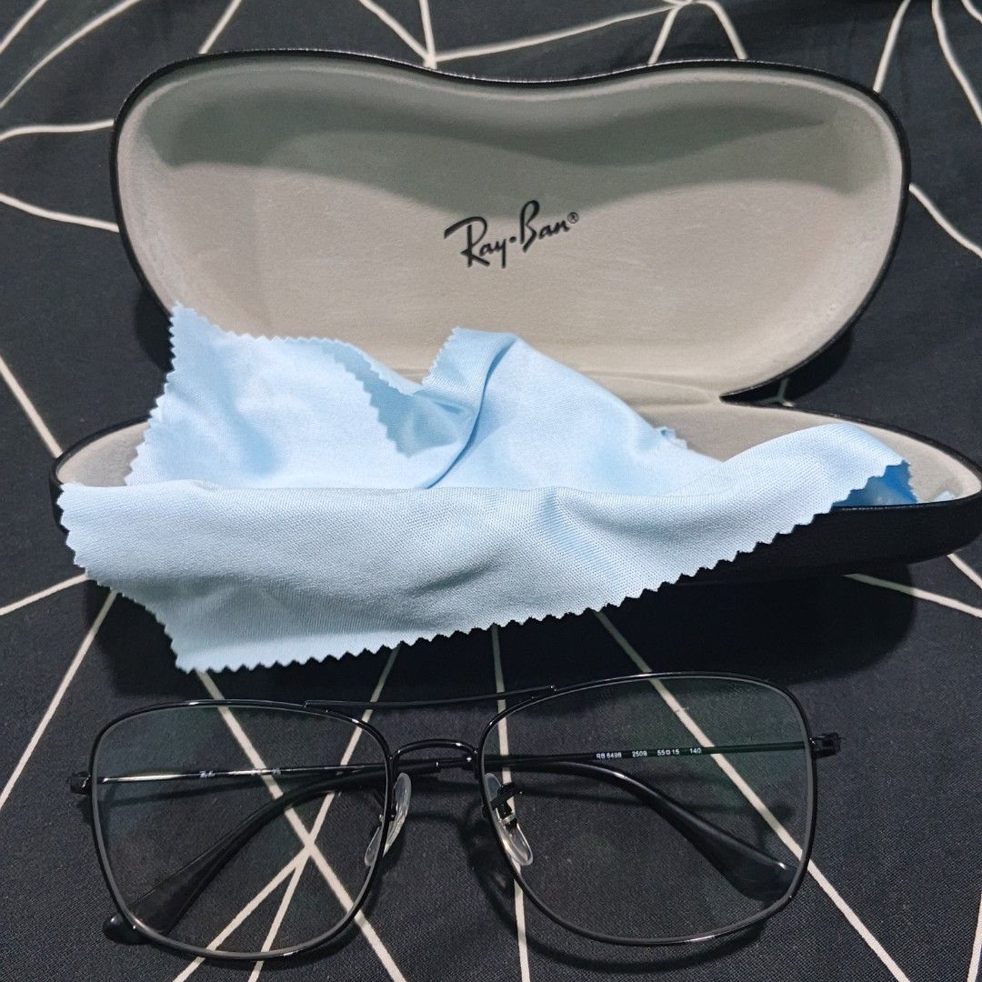 Ray-Ban RB 6498 Aviator Eyeglasses Black Frame (Category: Sunglasses & Eyewear) located in Manila. Submitted by xvx02 (Listing ID 1469266088, Image 3). Description: - Authentic Ray-Ban RB 6498 optical frames (Model: RB 6498 2509 55-15) - Classic double bridge pilot shape in sleek black - Size: Lens 55, Bridge 15, Temple 140 - Flawless condition: Zero scratches on frame and lenses - Includes original Ray-Ban hard leather case and light blue microf
