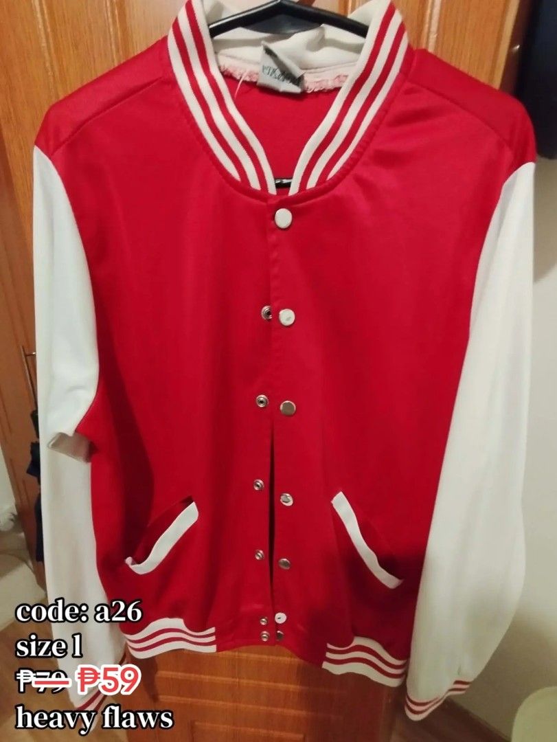 Red and White Varsity Jacket Size L Code a26 (Category: Coats, Jackets and Outerwear) located in Carmona. Submitted by ichorvault (Listing ID 1469284665, Image 1). Description: - Item: Red & White Varsity Jacket - Size: L (Code: a26) - Features: Snap button front, striped ribbed collar, cuffs, and hem, two front pockets with white trim - Condition: Heavy flaw - large tear near the underarm area where the red fabric has ripped open - Perfect for D