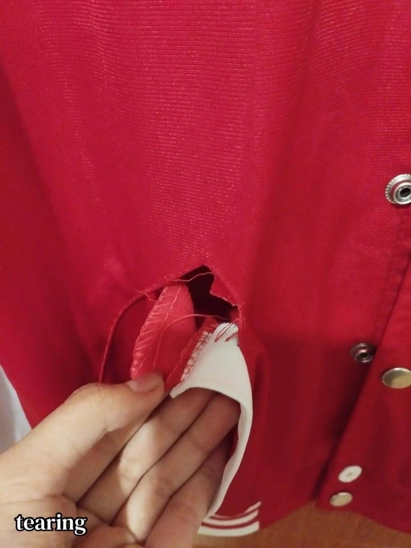Red and White Varsity Jacket Size L Code a26 (Category: Coats, Jackets and Outerwear) located in Carmona. Submitted by ichorvault (Listing ID 1469284665, Image 2). Description: - Item: Red & White Varsity Jacket - Size: L (Code: a26) - Features: Snap button front, striped ribbed collar, cuffs, and hem, two front pockets with white trim - Condition: Heavy flaw - large tear near the underarm area where the red fabric has ripped open - Perfect for D