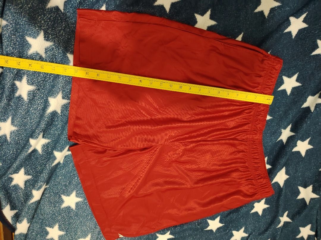 Red Athletic Shorts (Category: Activewear) located in Cebu City. Submitted by bravetree.3f281d (Listing ID 1469221204, Image 1). Description: - Color: Bright red - Material: Smooth and shiny athletic fabric - Waistband: Comfortable elastic with a stretchy fit - Details: Small logo tag near the hem and inner waistband tag - Style: Easy pull-on design - Versatility: Perfect for workouts or lazy days at home.