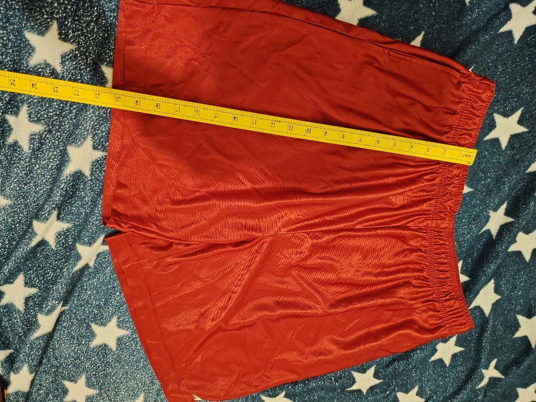Red Athletic Shorts (Category: Activewear) located in Cebu City. Submitted by bravetree.3f281d (Listing ID 1469221204, Image 3). Description: - Color: Bright red - Material: Smooth and shiny athletic fabric - Waistband: Comfortable elastic with a stretchy fit - Details: Small logo tag near the hem and inner waistband tag - Style: Easy pull-on design - Versatility: Perfect for workouts or lazy days at home.