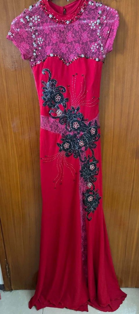 Red Long Evening Dress with Lace and Beading (Category: Evening dresses & gowns) located in Caloocan City. Submitted by mylove326 (Listing ID 1469237021, Image 3). Description: - Color: Striking red with a lace top - Details: Intricate beads and sequins around the neckline and shoulders - Design: Elegant black floral embroidery flowing diagonally down the front and back - Silhouette: Mermaid cut with a flattering small train - Back: Chic keyhole 