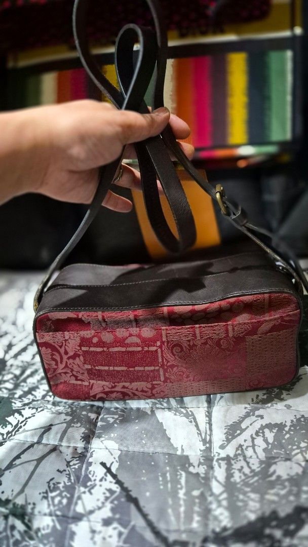 Red patterned patchwork and dark leather crossbody bag (Category: Cross-body Bags) located in Manila. Submitted by ertya (Listing ID 1469380897, Image 2). Description: no rubs good condition.