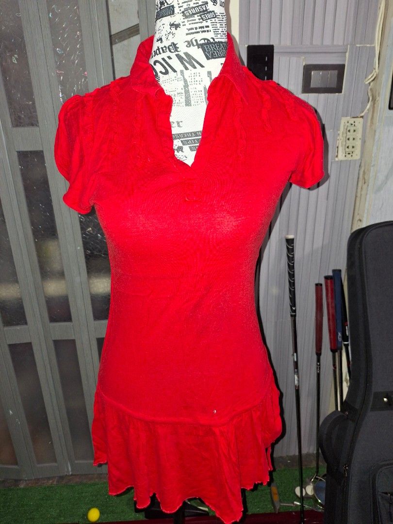 Red Ruffled V-Neck Short Sleeve Tunic Top (Category: Blouses) located in Manila. Submitted by mialiurshop (Listing ID 1469228374, Image 1). Description: - Color: Bright red - Style: Short sleeve tunic top with flared peplum bottom tier - Details: Ruffled trim along V-neckline, sleeves, and dropped waist hem - Material: Ribbed stretch fabric for a comfortable fit.