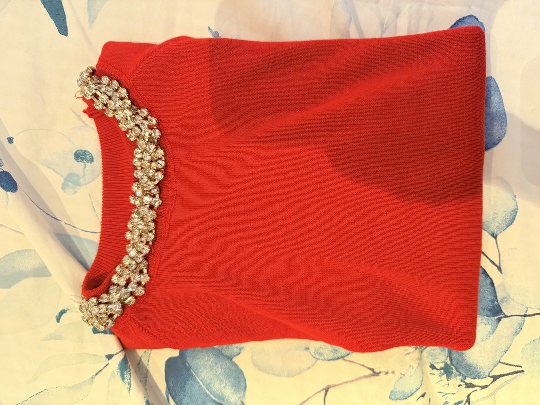 Red Short Sleeve Top with Rhinestone Collar (Category: Blouses) located in Cebu City. Submitted by cutexoxoshop (Listing ID 1469174395, Image 2). Description: - Color: Bright red - Style: Short-sleeve knit top with round neckline - Details: Heavily decorated with sparkling rhinestones and crystals - Fit: Stretchy and super comfortable - Occasion: Great for dinners, parties, or dressed-up casual days.