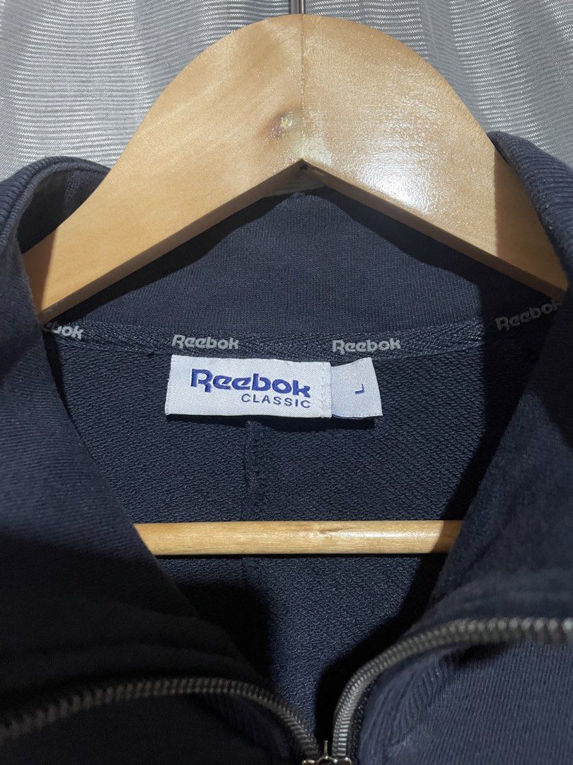 Reebok Classic Forever Full Zip Jacket Dark Blue Size L (Category: Coats, Jackets and Outerwear) located in Calbayog City. Submitted by thriftme.bro (Listing ID 1469324479, Image 3). Description: Dark blue Reebok Classic full zip jacket in size large. Features a high neck, embroidered logo, front zip pockets, and a clean, lightly worn condition. Perfect for cooler weather..