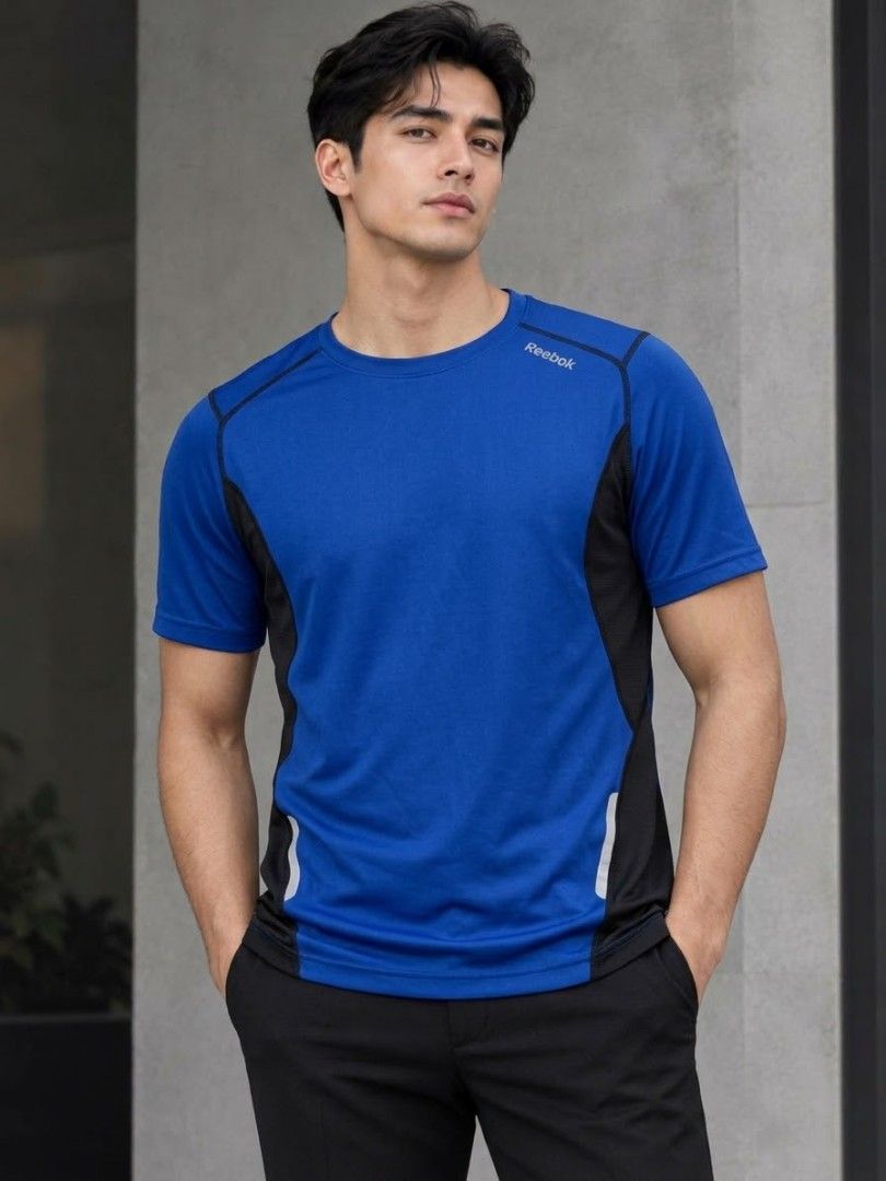 REEBOK PLAY DRY ATHLETIC TRAINING SHIRT (Category: Activewear) located in Pagsanjan. Submitted by thriftyclothes33 (Listing ID 1469305316, Image 1). Description: 🔥 REEBOK PLAY DRY ATHLETIC TRAINING SHIRT 💙🏃 ✨ Play Dry moisture-wicking fabric ✨ Royal blue with black side panels ✨ Reflective accents on lower sides ✨ Lightweight & breathable ✨ Great for workouts, running & everyday wear 🏷️ Size 2XL on tag 📏 Width 26" • Length 32" 👕 Fit: Relaxe