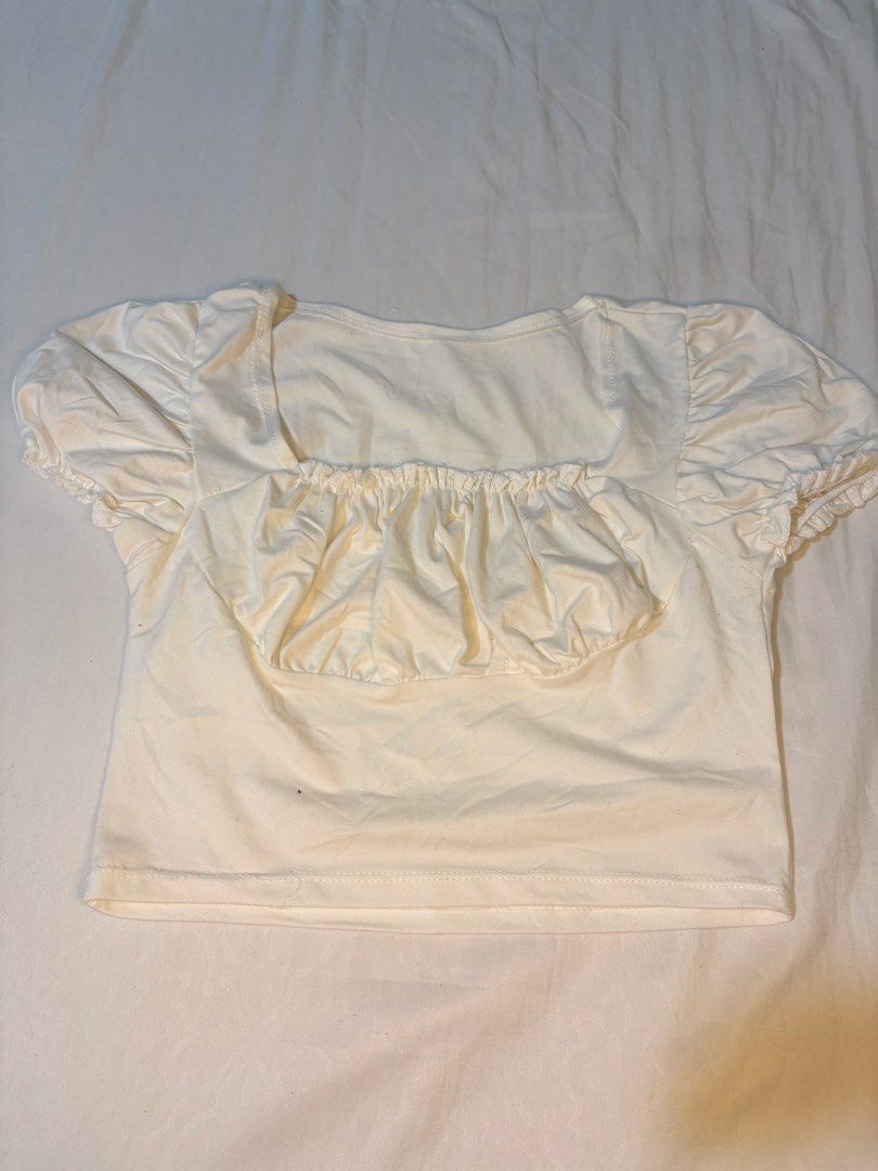 Ribbed Brown Crop Top & White Ruched Crop Top Bundle (Category: Sleeveless) located in Manila. Submitted by thriftwithgem (Listing ID 1469255489, Image 3). Description: - Set of 2 trendy crop tops - Top 1: Ribbed brown high neck design - Top 2: White with short puff sleeves and ruched front detail - Easy to style with high-waisted jeans, shorts, or skirts - Perfect for casual daily wear, dates, or hangouts - Selling as a bundle.