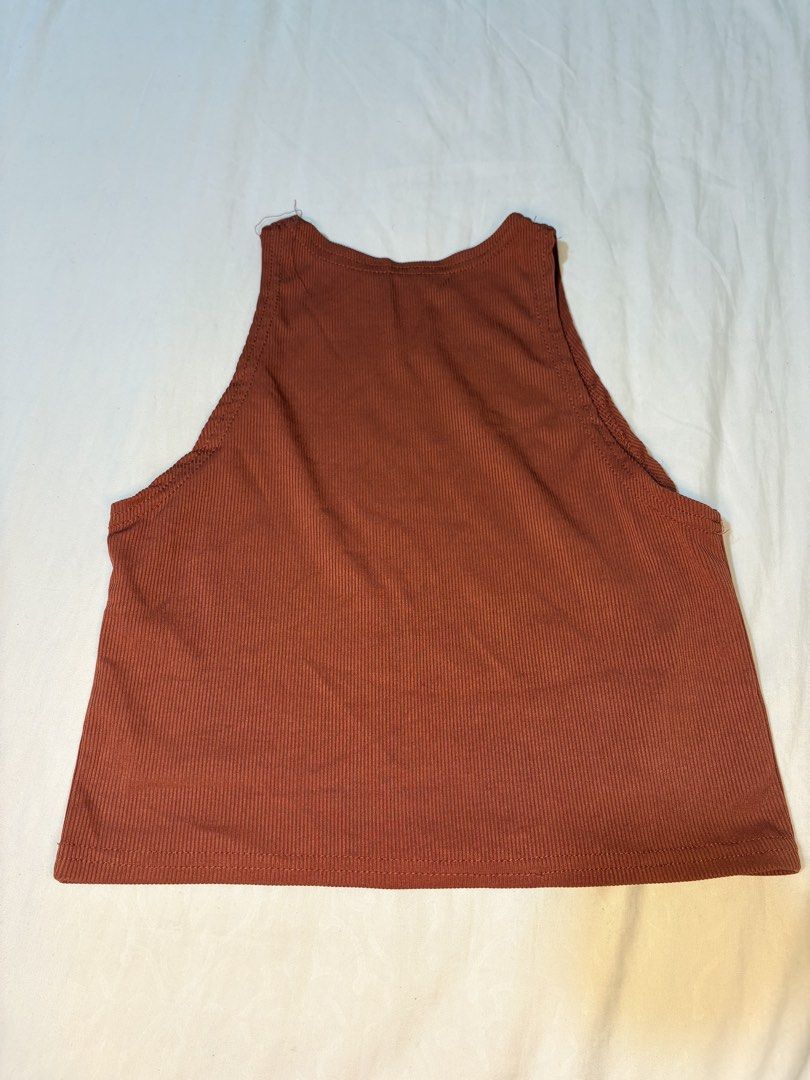 Ribbed Brown Crop Top & White Ruched Crop Top Bundle (Category: Sleeveless) located in Manila. Submitted by thriftwithgem (Listing ID 1469255489, Image 2). Description: - Set of 2 trendy crop tops - Top 1: Ribbed brown high neck design - Top 2: White with short puff sleeves and ruched front detail - Easy to style with high-waisted jeans, shorts, or skirts - Perfect for casual daily wear, dates, or hangouts - Selling as a bundle.