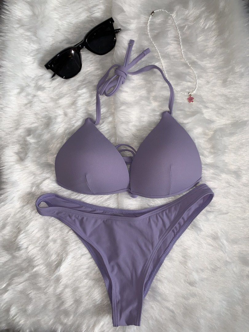 Ribbed Purple Bikini Set Halter Top (Category: Bikinis & Swimsuits) located in Mandaluyong City. Submitted by gentle.segoviajam (Listing ID 1469325487, Image 1). Description: - Gorgeous purple ribbed bikini set - Halter neck top with adjustable ties for a custom fit - Trendy strappy cutout details in the center - Matching low-rise bottoms - Soft, comfortable textured fabric - Perfect for beach trips and pool parties.