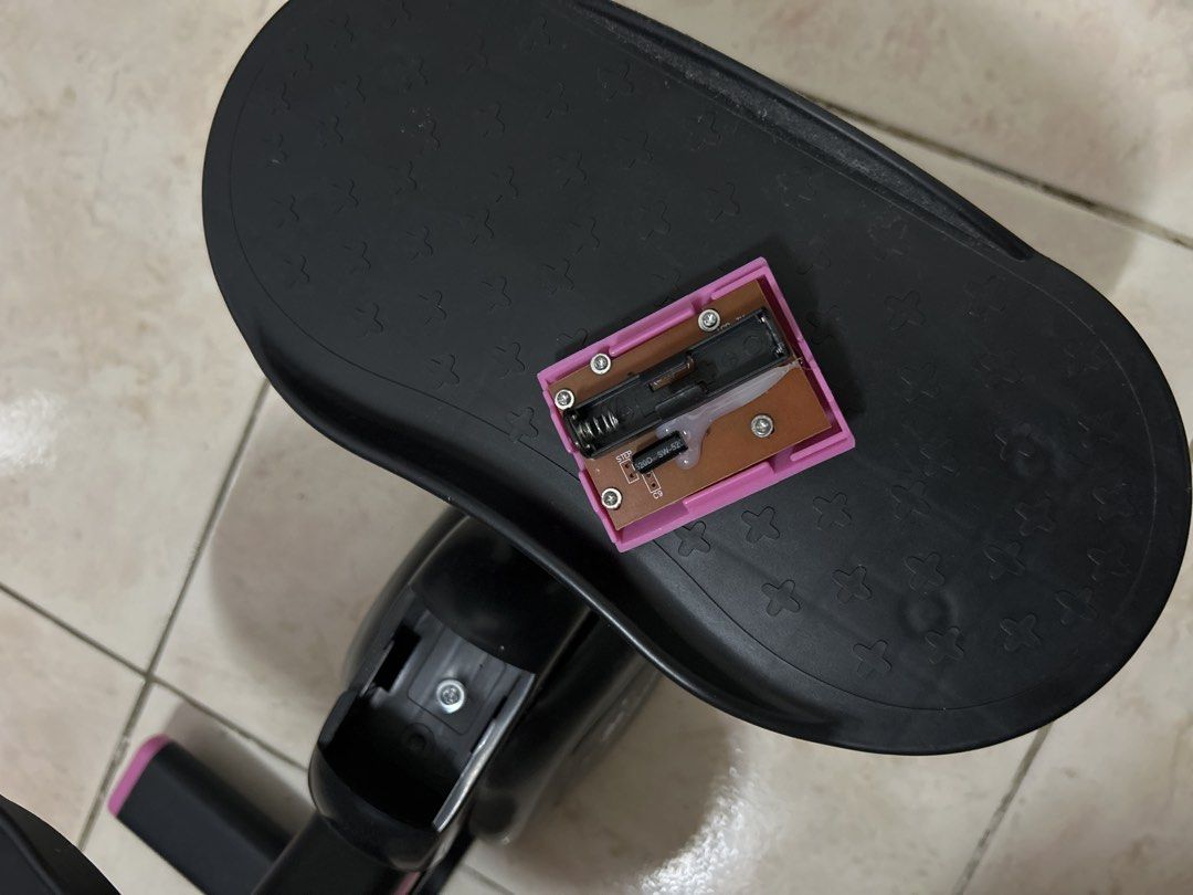 RIFOAMXN Mini Stepper Home Exercise Equipment (Category: Cardio & Fitness Machines) located in Pasig City. Submitted by prewuv (Listing ID 1469292728, Image 3). Description: Black and pink mini stepper from RIFOAMXN. Built-in electronic monitor tracking count, time, calories, and strides per minute. Operates on hydraulic cylinders. Detachable digital monitor display pops out easily for battery changes. Nonslip foot pedals ensure stability during 