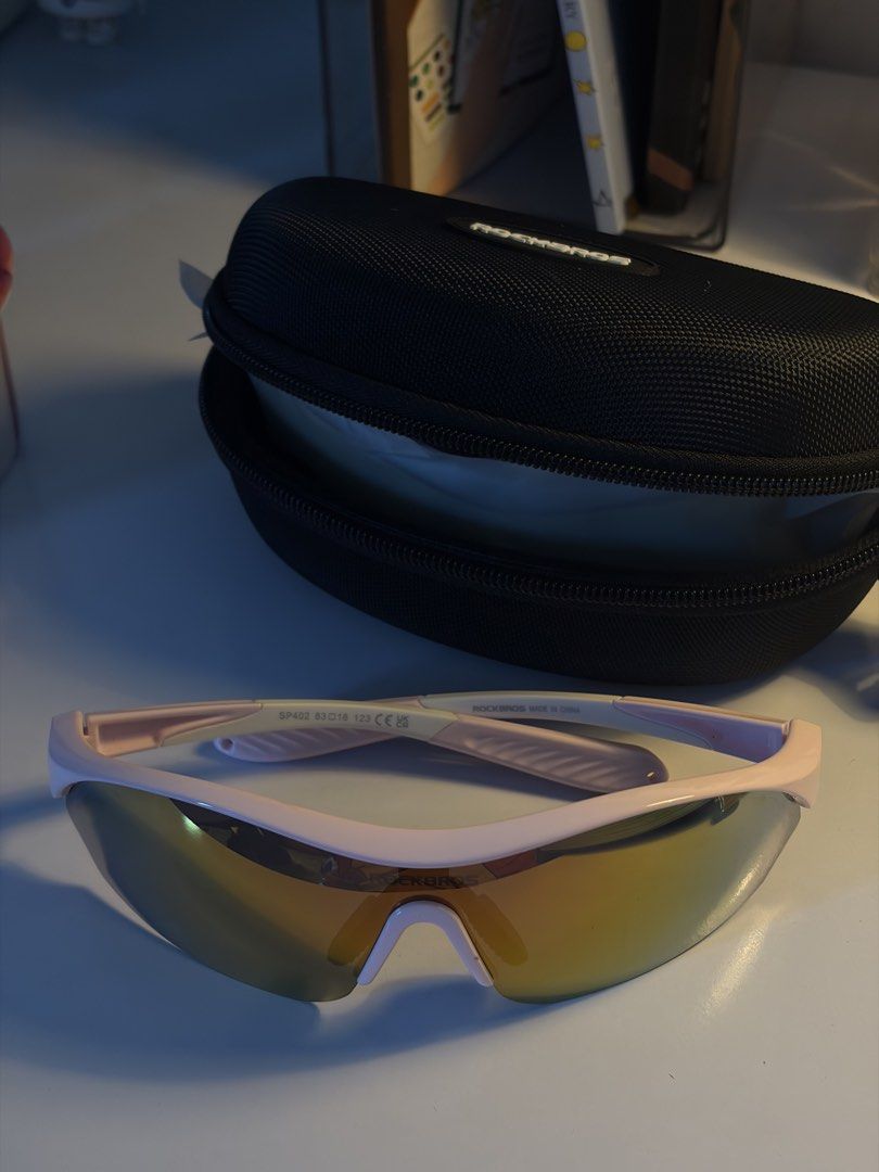 Unisex Polarized Running Shades (Category: Sunglasses & Eyewear) located in Quezon City. Submitted by mkdeclutters_ (Listing ID 1469234557, Image 2). Description: - Used once only. Comes with complete set: hard case, 2 other lenses, microfiber cloth - Adjustable nose pad - Ideal For: Outdoor runs, cycling, and fitness workouts RFS: was gifted with new running shades .