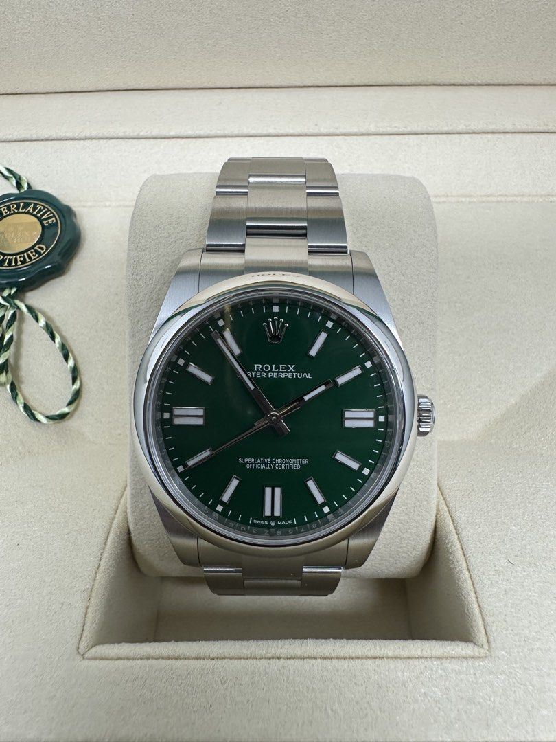 Rolex Oyster Perpetual Green Dial 41MM 124300 (Category: Watches) located in Singapore. Submitted by kckhoo (Listing ID 1469312989, Image 3). Description: - Model: Rolex Oyster Perpetual 41MM -124300 -Feb 2025 set - Dial: Striking Green - Material: Stainless steel case and oyster bracelet - Condition: Brand New/Unworn/Unsized (Sticker still intact as shown in picture) - Includes: Full set (original green presentation box, manuals, warranty paperw