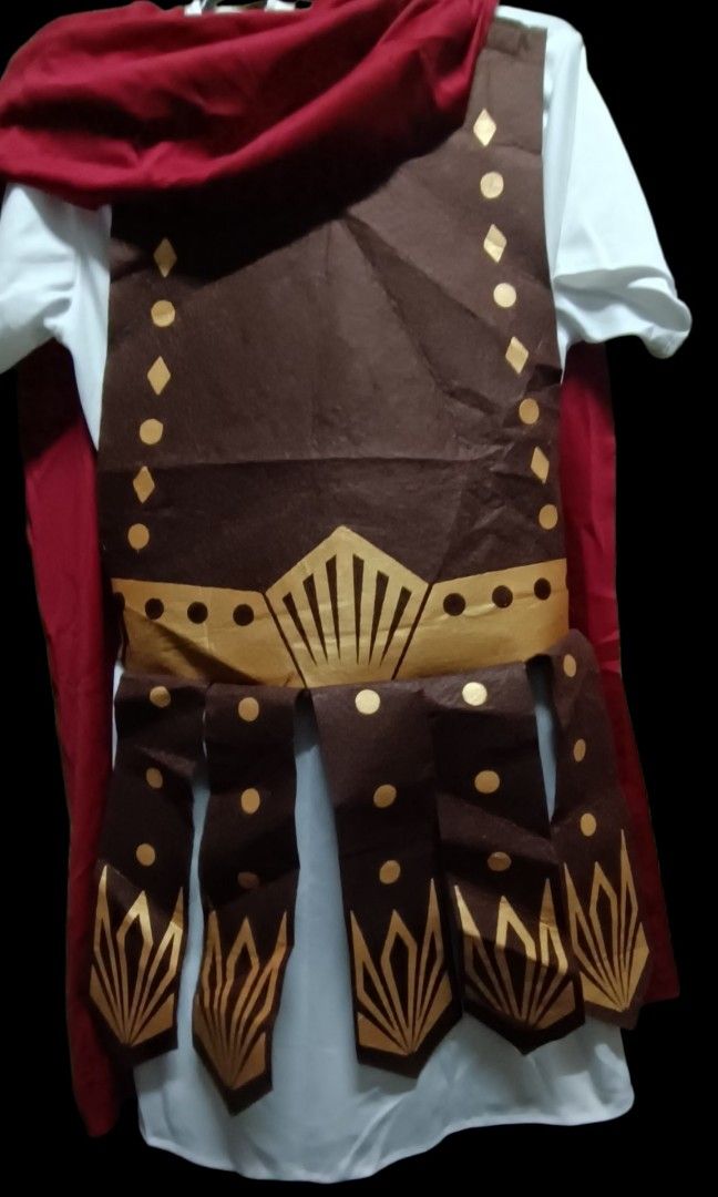 Roman Centurion/ Ancient Roman Military (Category: Babies & Kids Fashion) located in Pasig City. Submitted by heidedieh (Listing ID 1469309429, Image 1). Description: Includes; Tunic with Armour Cape leg guard arm guard chest 38 length 29 imches 8-10 on tag.