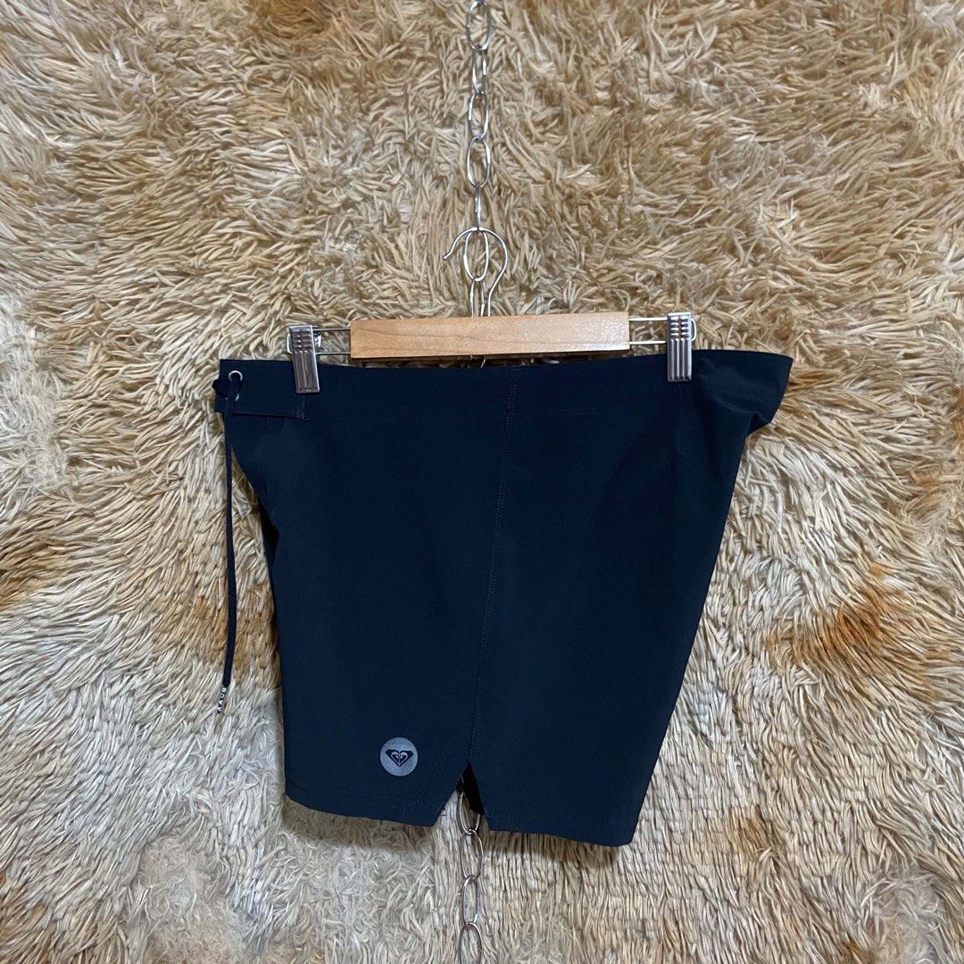 Roxy Black Board Shorts Swim Shorts (Category: Shorts) located in Butuan. Submitted by jc13thrifts (Listing ID 1469338720, Image 2). Description: - Brand: Roxy - Color: Solid black - Material: Lightweight, quick-dry fabric - Waist: Adjustable drawstring with branded metal aglets - Details: Small tonal Roxy logo on left hem, side leg vents for comfortable movement - Condition: Excellent.