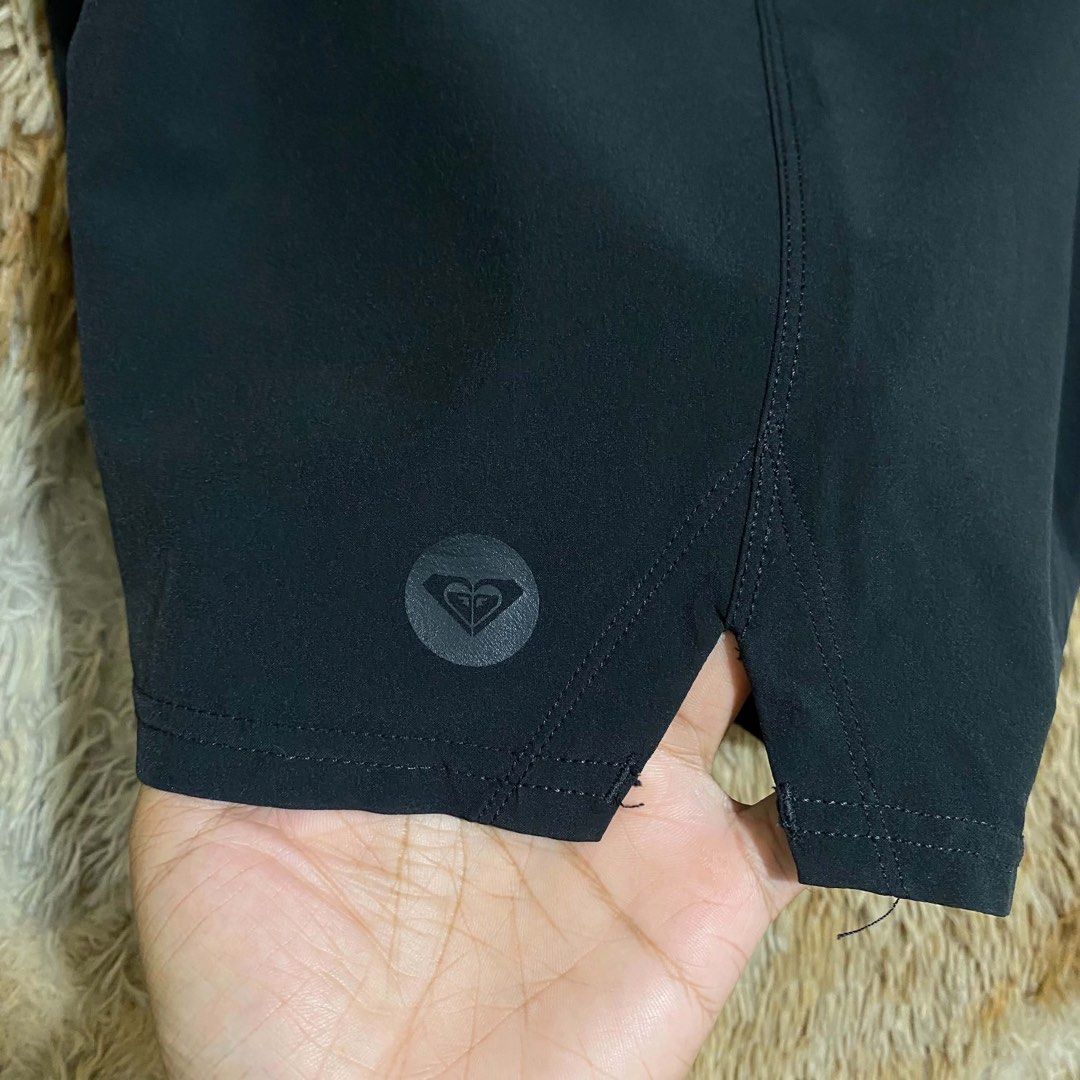 Roxy Black Board Shorts Swim Shorts (Category: Shorts) located in Butuan. Submitted by jc13thrifts (Listing ID 1469338720, Image 3). Description: - Brand: Roxy - Color: Solid black - Material: Lightweight, quick-dry fabric - Waist: Adjustable drawstring with branded metal aglets - Details: Small tonal Roxy logo on left hem, side leg vents for comfortable movement - Condition: Excellent.