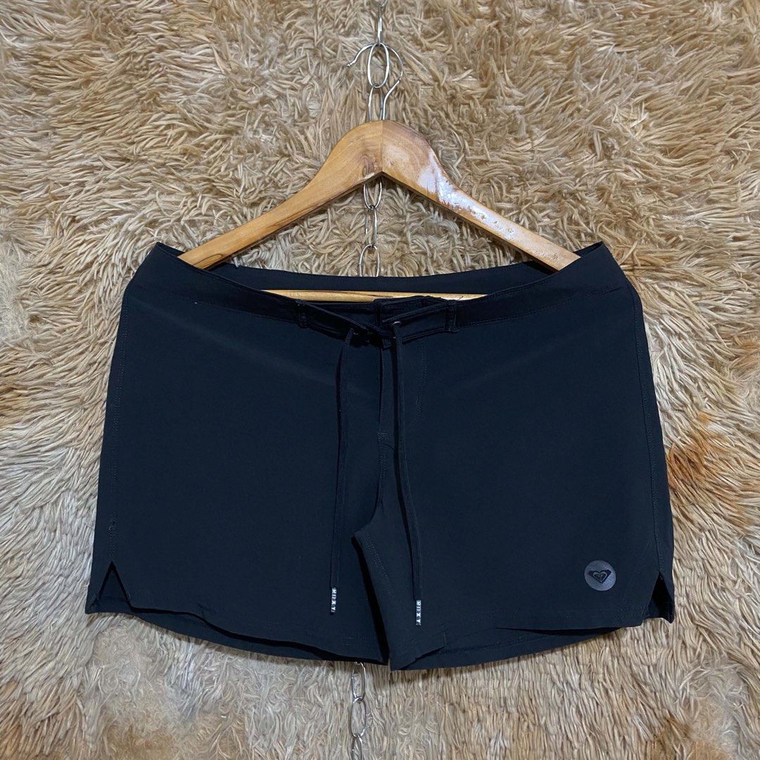 Roxy Black Board Shorts Swim Shorts (Category: Shorts) located in Butuan. Submitted by jc13thrifts (Listing ID 1469338720, Image 1). Description: - Brand: Roxy - Color: Solid black - Material: Lightweight, quick-dry fabric - Waist: Adjustable drawstring with branded metal aglets - Details: Small tonal Roxy logo on left hem, side leg vents for comfortable movement - Condition: Excellent.