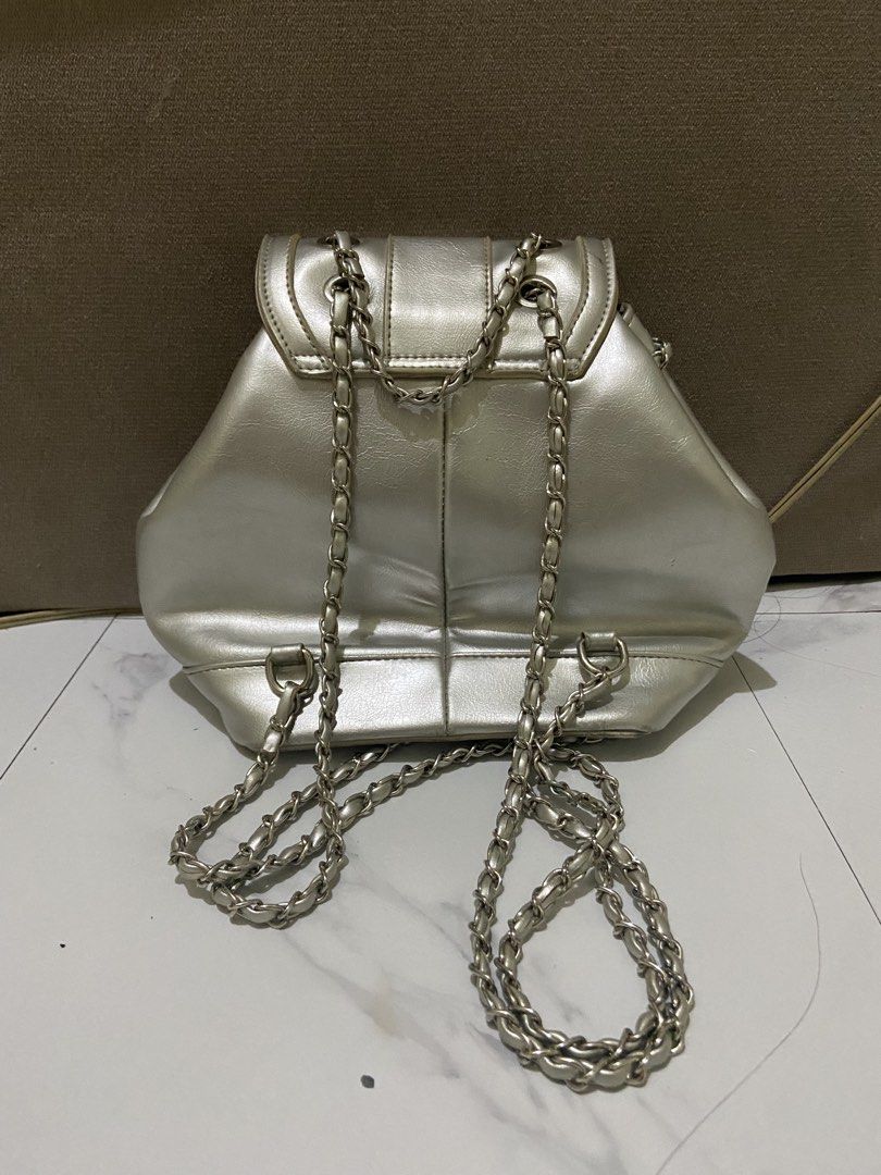 [RUSH SALE] Silver Metallic Chain Mini Backpack (Category: Backpacks) located in Pasig City. Submitted by ellerarissime (Listing ID 1469283731, Image 2). Description: RFS: Decluttering. Sales are slightly negotiable. PM for more item inquiries. Loc: Santolan, Pasig.
